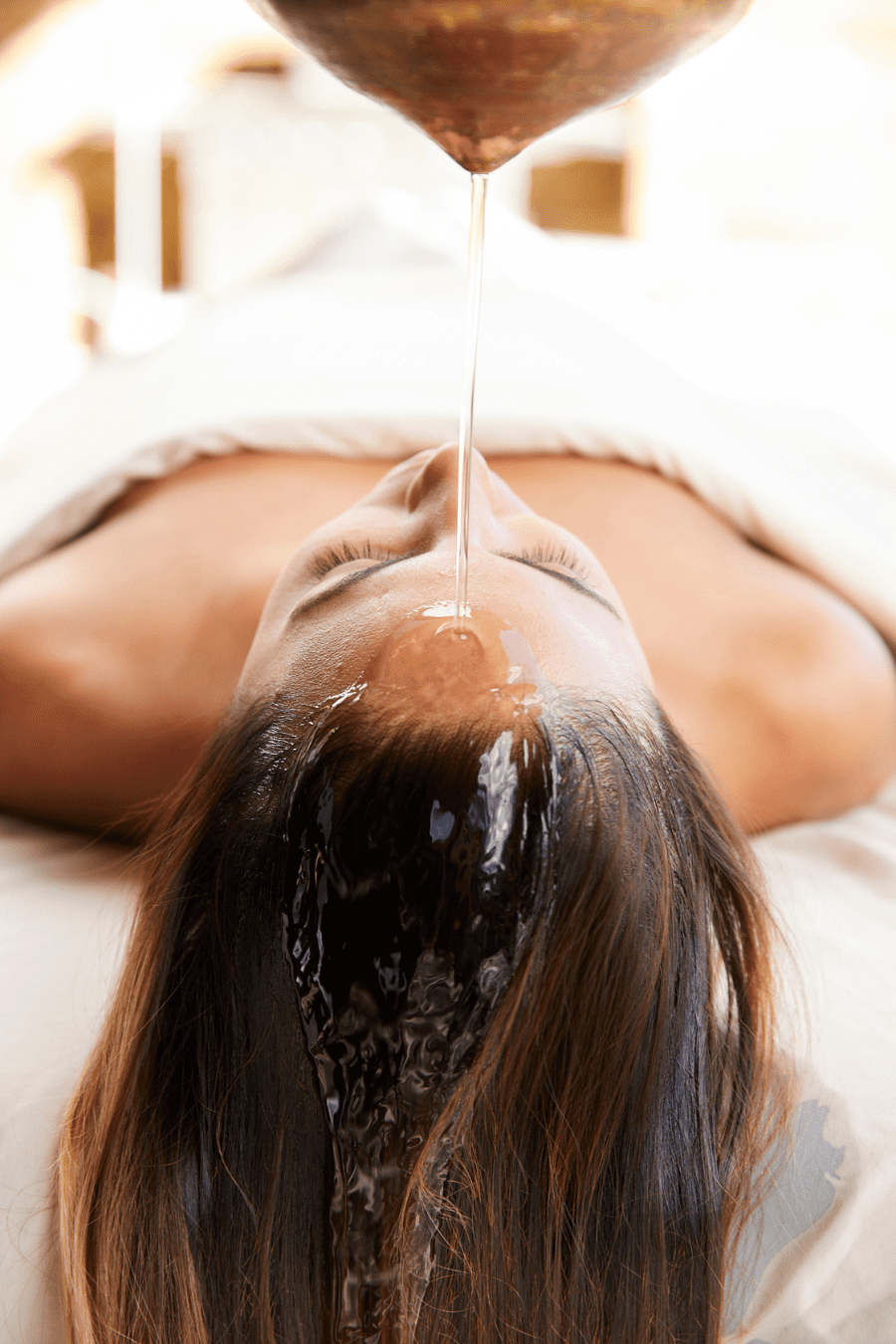 a woman enjoying a peaceful moment of total relaxation, lying back in a comfortable space, eyes closed, fully immersed in a tranquil and soothing atmosphere.