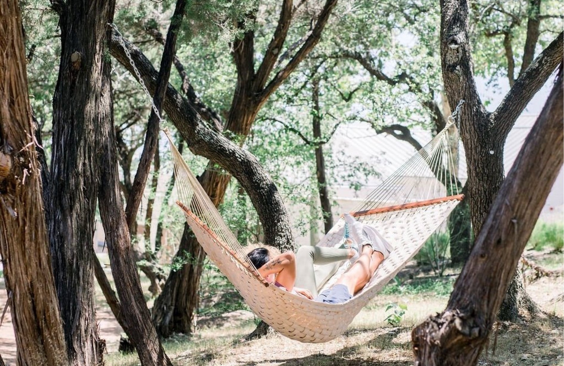 two people relaxing on hammock outside