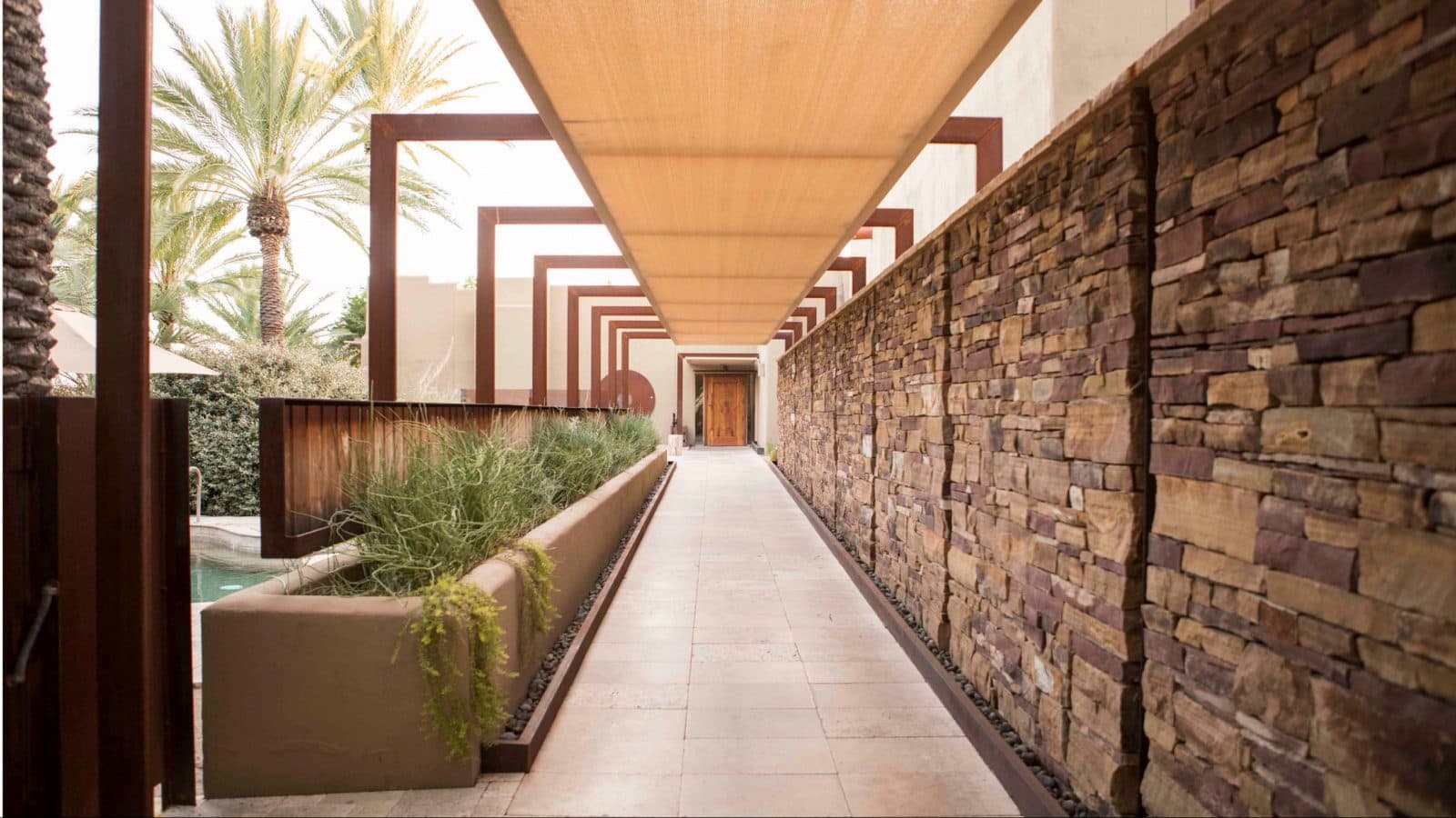 outdoor hallway with brick wall