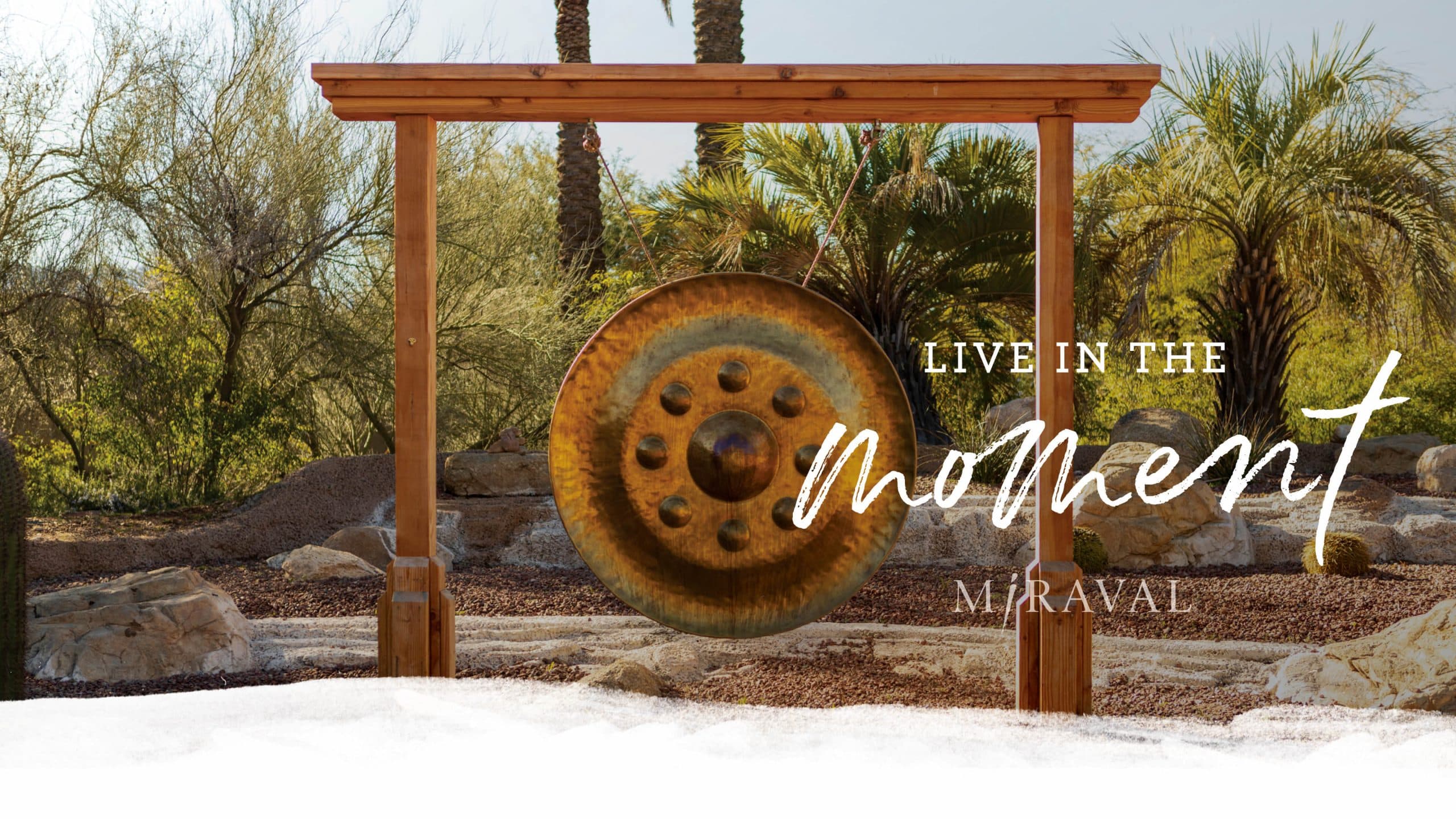 live in the moment text with bell background