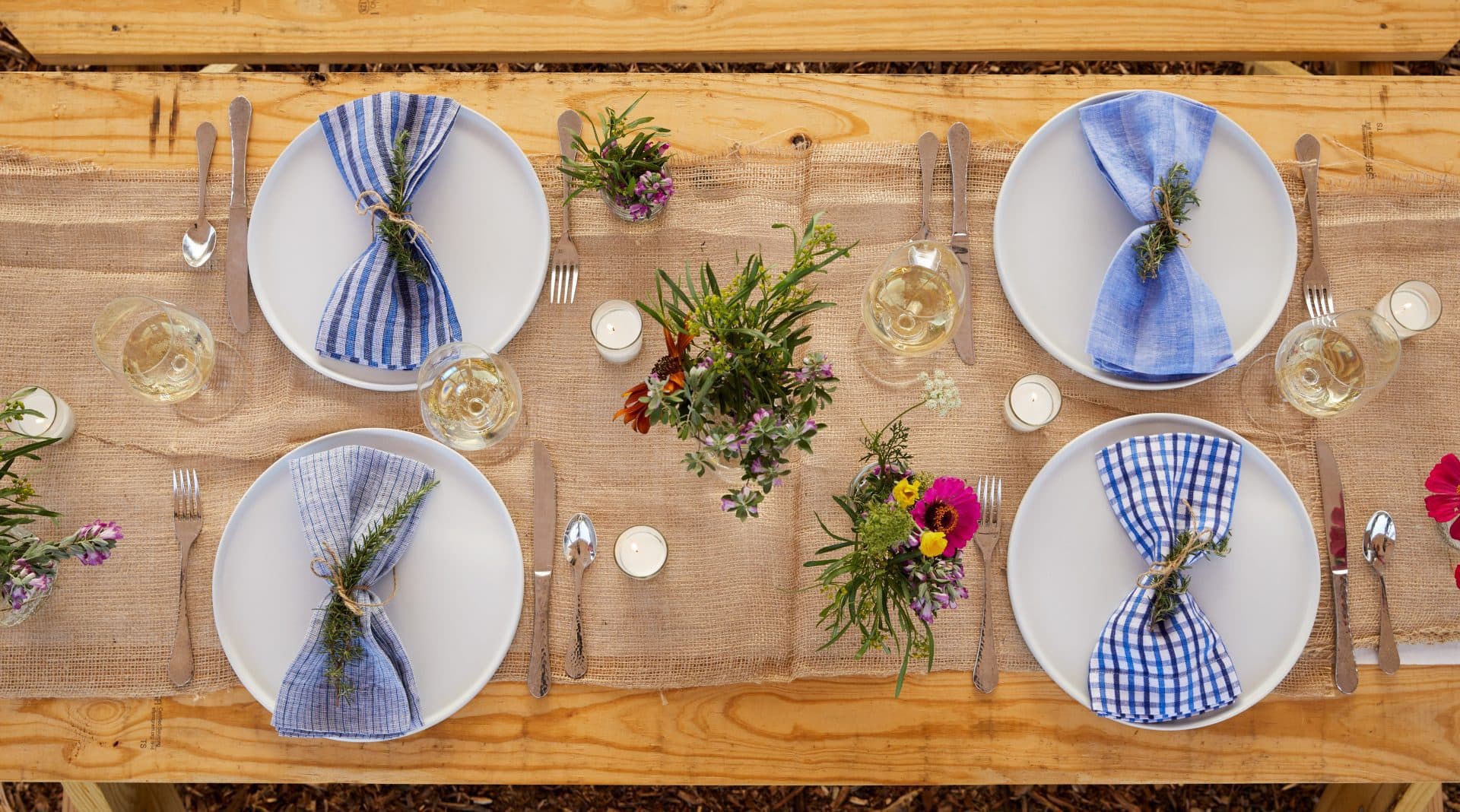 Beautiful decorated table with flowers, candles, napkins and wine glasses