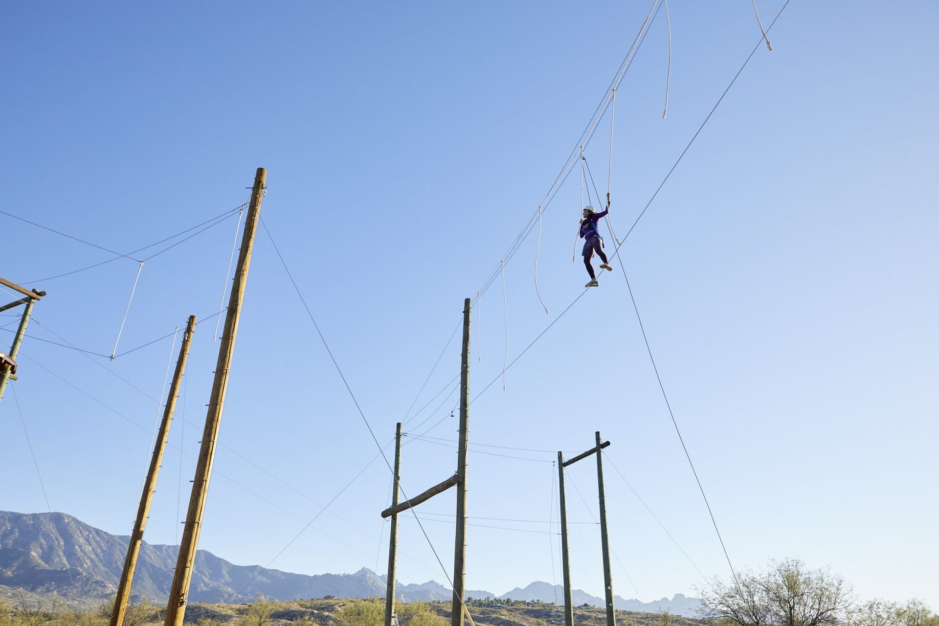 Woman walking tightrobe