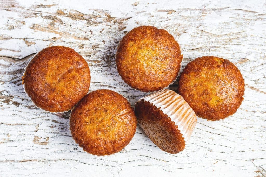 Muffins on white wood
